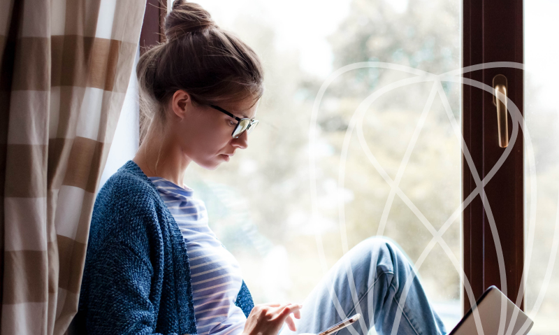 woman in glasses on her phone